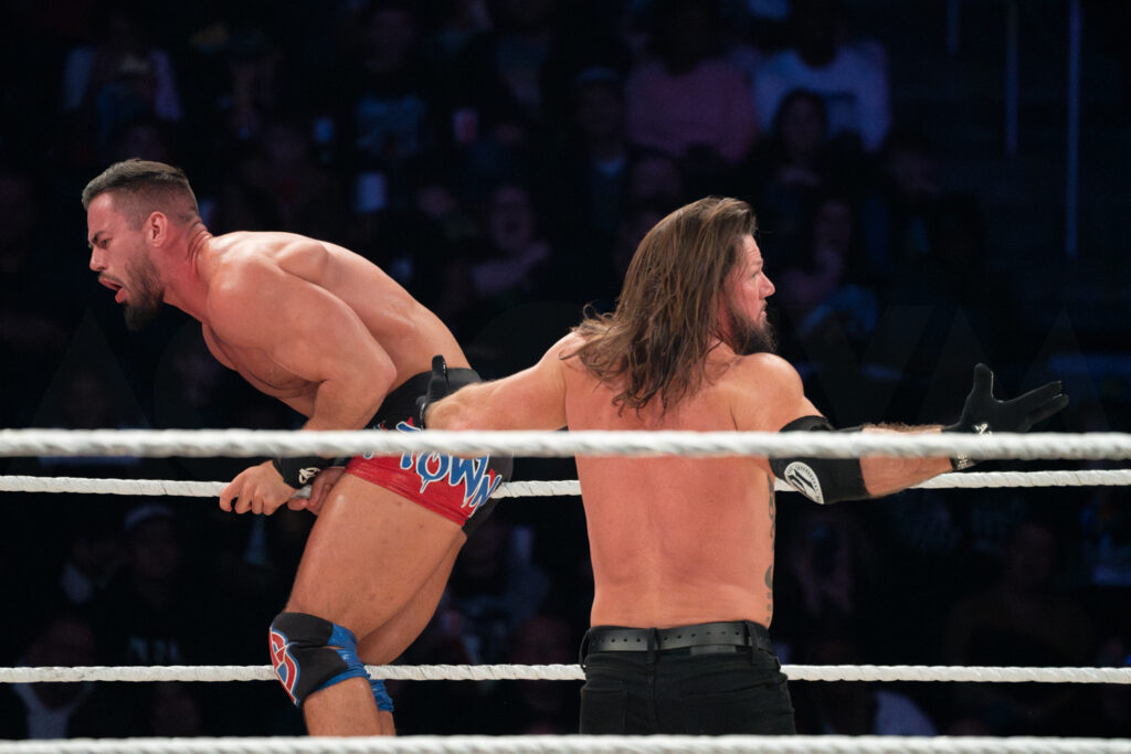 36_WWE_AUSTIN THEORY, AJ STYLES_WWE HOLIDAY TOUR 2023_AMI NICOLE ACRONYM